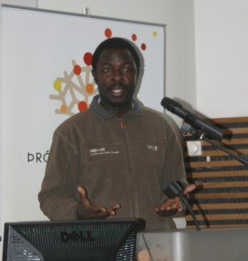 William Nsimiire from Uganda giving a speech.